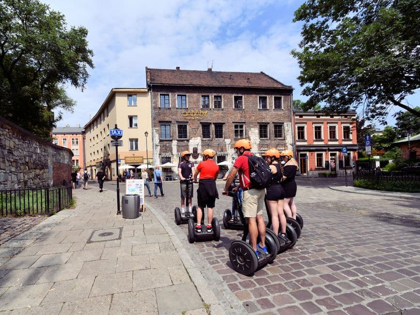 Cobbled street in Kazimierz, Krakow's Jewish quarter, with the Hamsa Hummus and Happiness restaurant on the corner of Szeroka Street