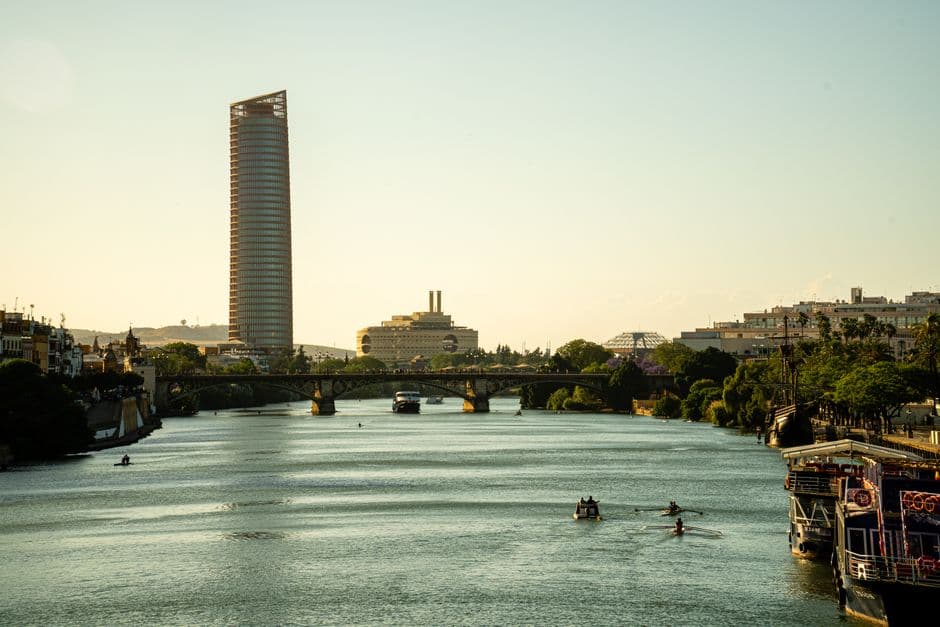 The Triana bridge over the Guadalquivir river in Seville at dusk