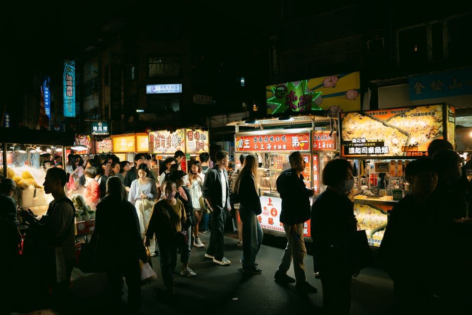 Night market food stalls lit up after dark, the scene the best street food cities rankings try to measure