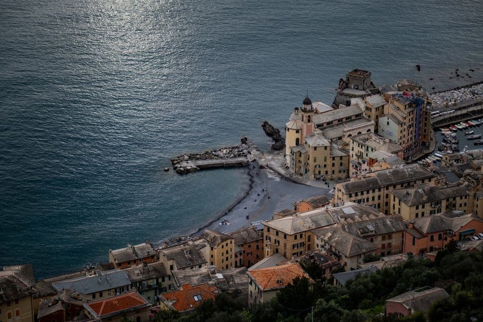 Aerial view of the Italian coastal town of Camogli in Liguria under grey light, with an almost empty beach