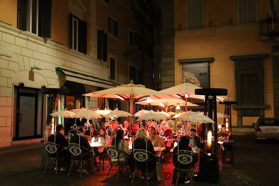 A Roman trattoria table set for dinner, the starting point for a guide to the best food in Rome