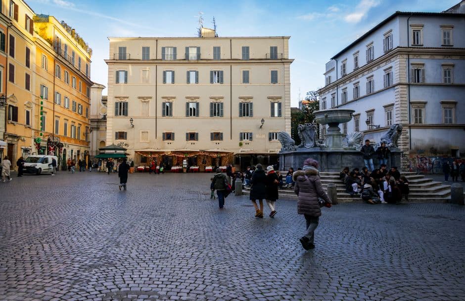A narrow ivy-covered street in Trastevere, Rome, where the best trattorias sit off the main square