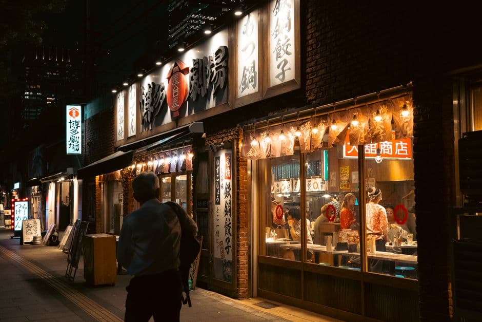 A Tokyo street at night outside a traditional restaurant, the setting for a guide to the best food in Tokyo