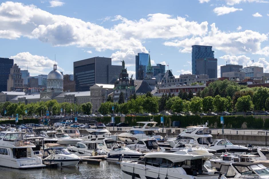 View across the Old Port marina towards the dome of Bonsecours Market and the spire of Notre-Dame-de-Bon-Secours chapel in Old Montreal