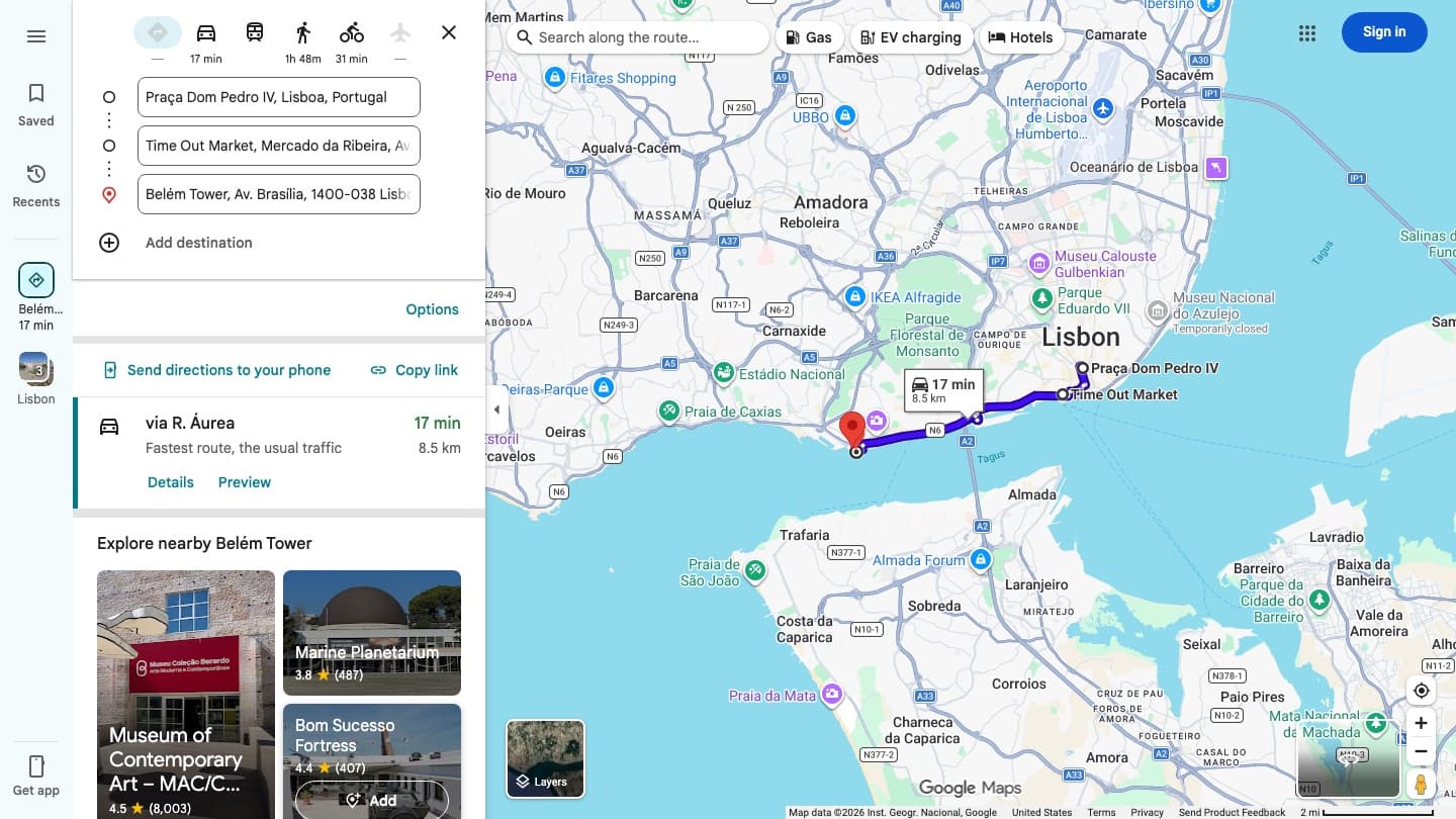 A three stop Google Maps route across Lisbon on a computer, with the Add destination button under the list of stops and the transit and flight icons showing a dash instead of a travel time