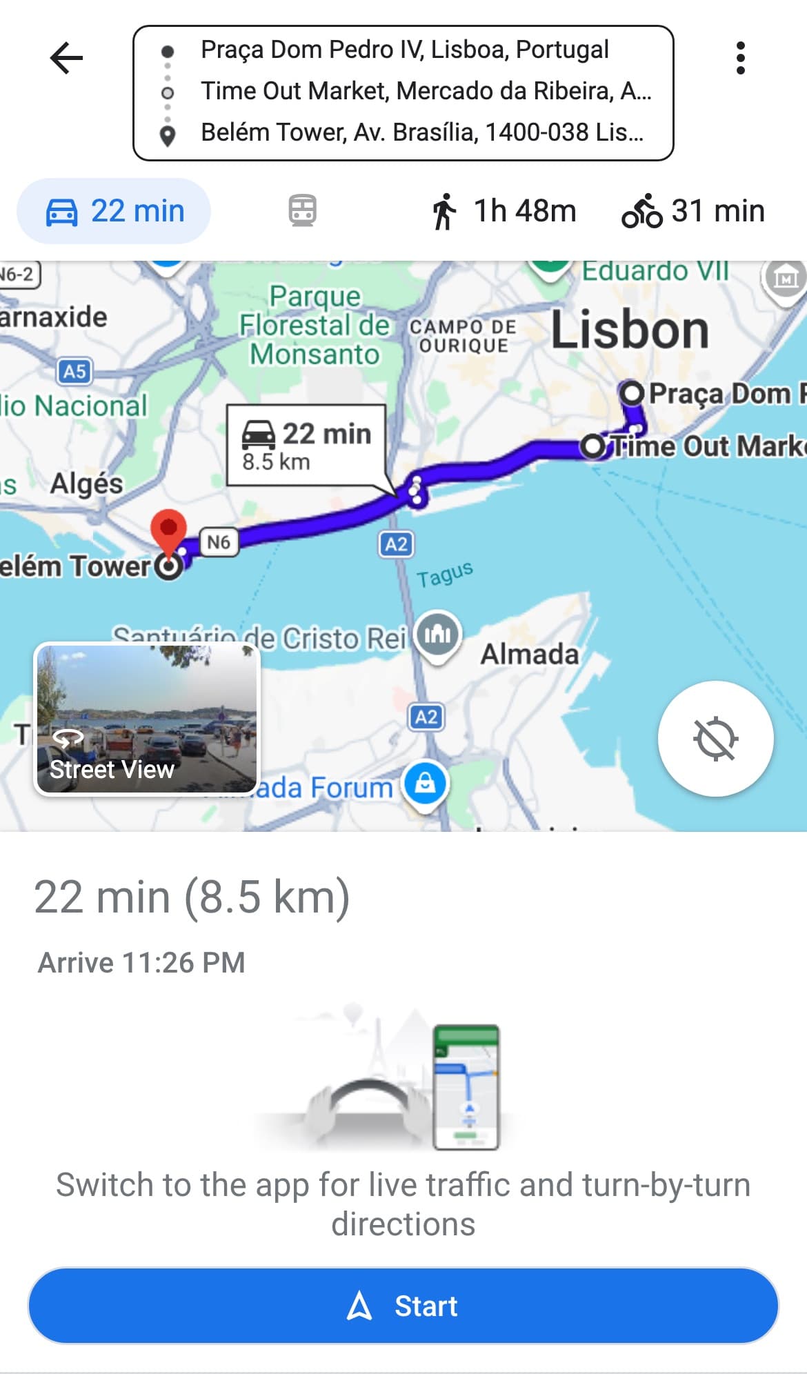 Google Maps in a phone browser showing a three point route from Praca Dom Pedro IV to Time Out Market to Belem Tower in Lisbon, with the driving time of 22 minutes and 8.5 km selected