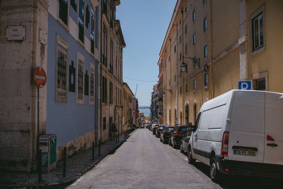 A narrow cobbled street in Alfama, Lisbon, where the old tascas are still worth eating in