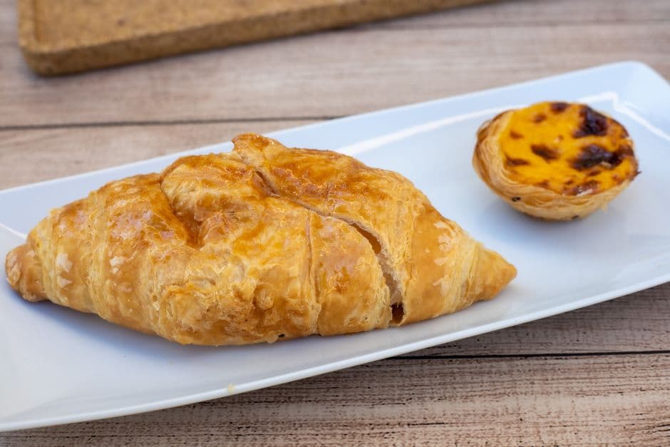 A pastel de nata with a blistered caramelized top, the pastry Lisbon is known for